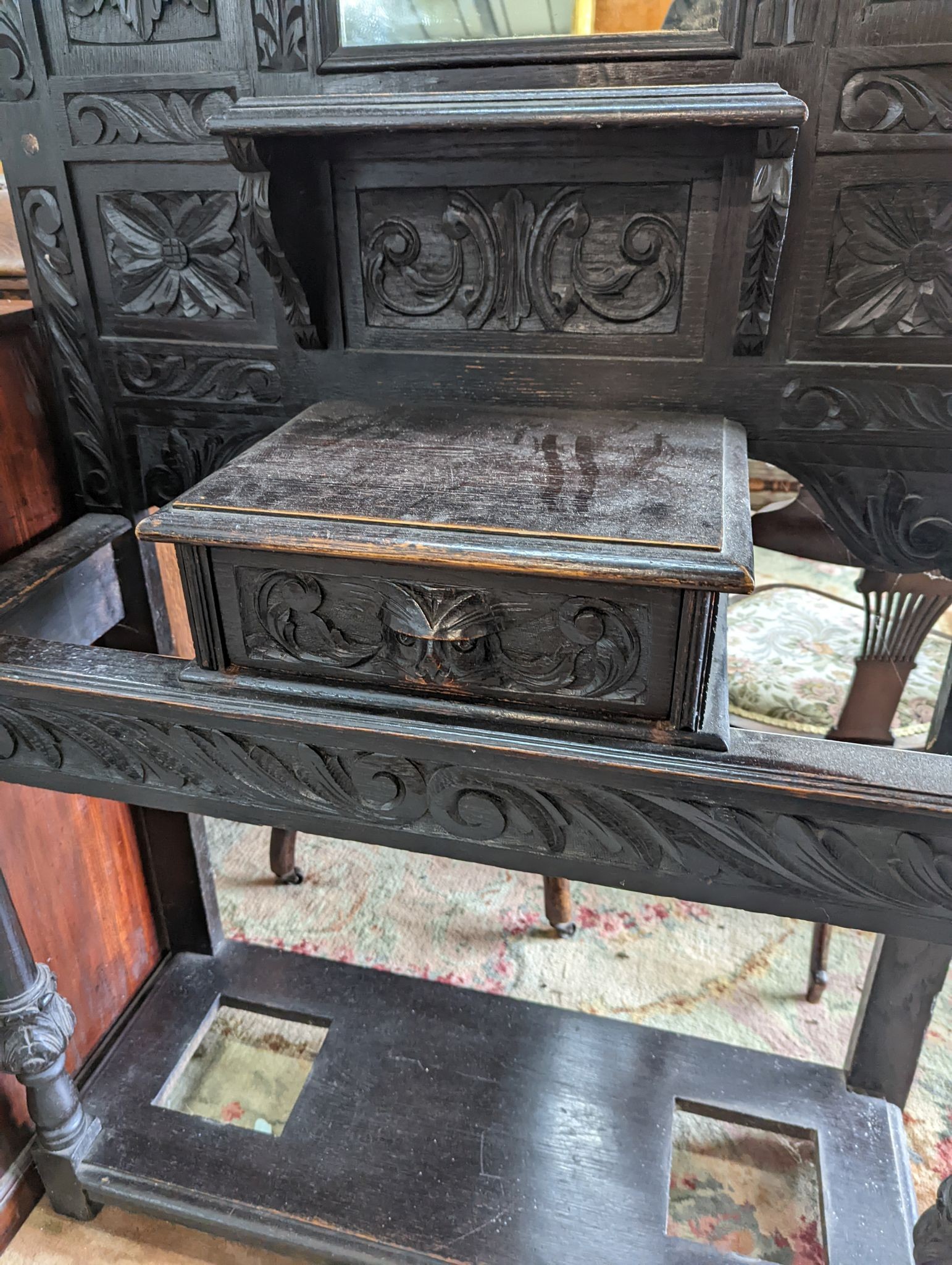 A late Victorian carved oak hall stand, width 102cm, depth 34cm, height 188cm